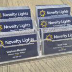 Novelty Lights business cards using the 2026 logo